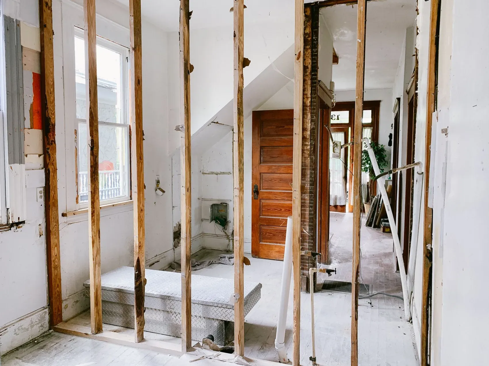 Interior wall opened to bare studs during demolition