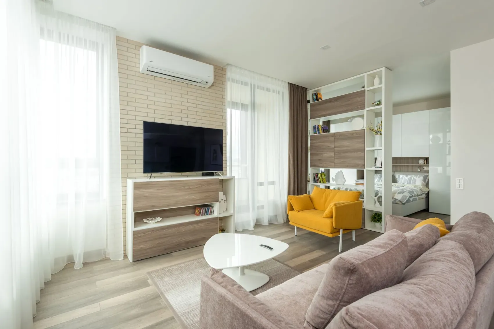 Wall-mounted mini-split HVAC in a bright modern living room