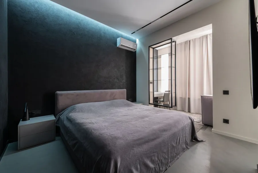 Bright modern bedroom with a clean wall-mounted mini-split HVAC